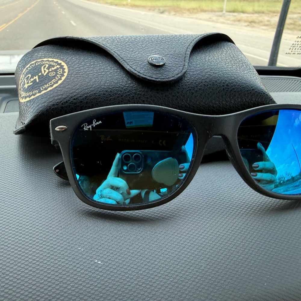 Ray-Ban Black Frames with Vibrant Blue Lenses